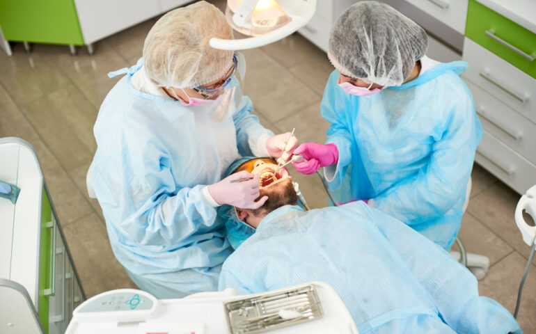 dentist-checking-patient-clinic